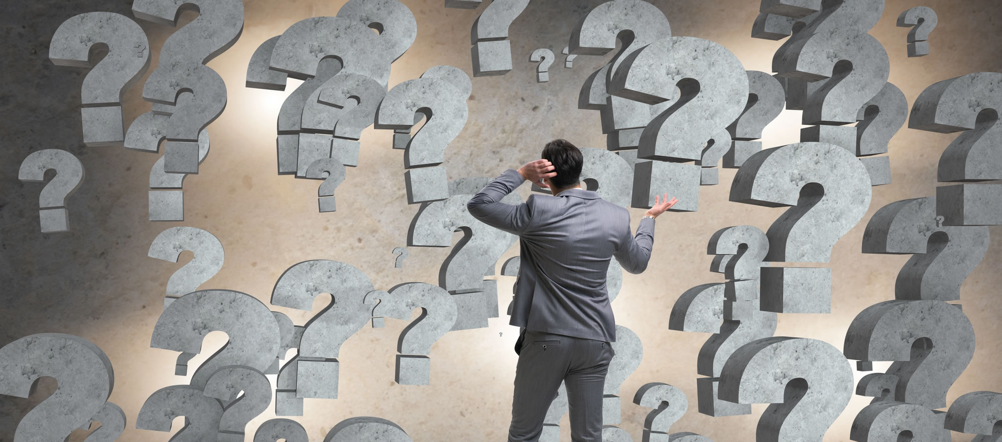 Businessman facing questions in business