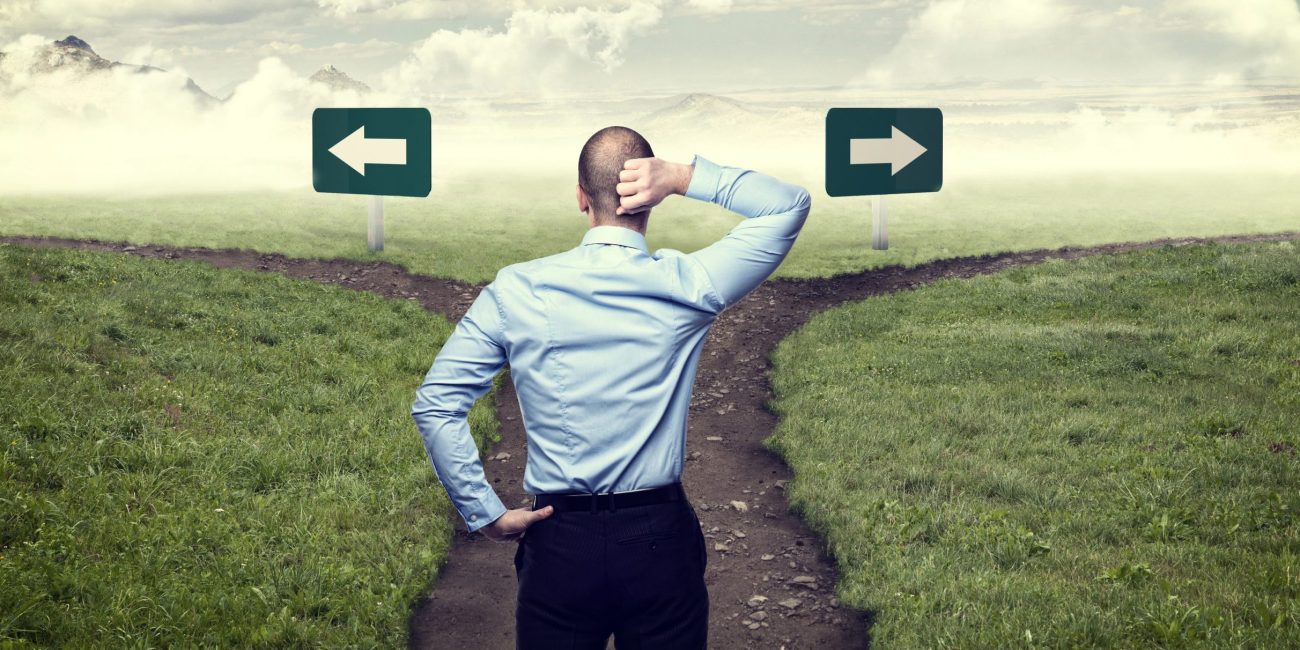 Businessman at cross roads - rebrand or replatform?